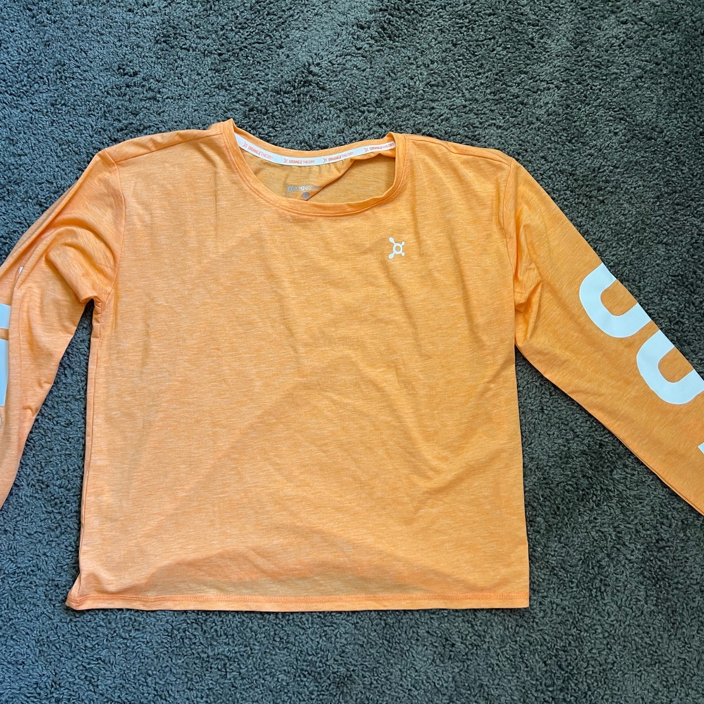 Orangetheory Fitness long sleeve ALL OUT top. Never worn